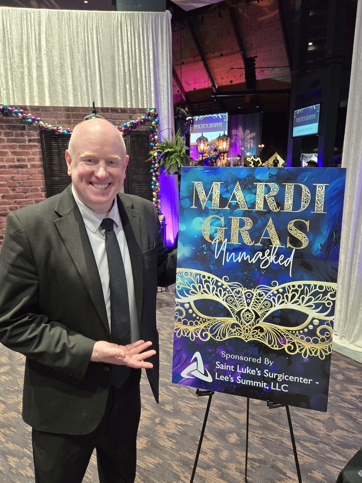 Saint Luke’s Mardi Gras gala, strolling through the silent-auction preview.