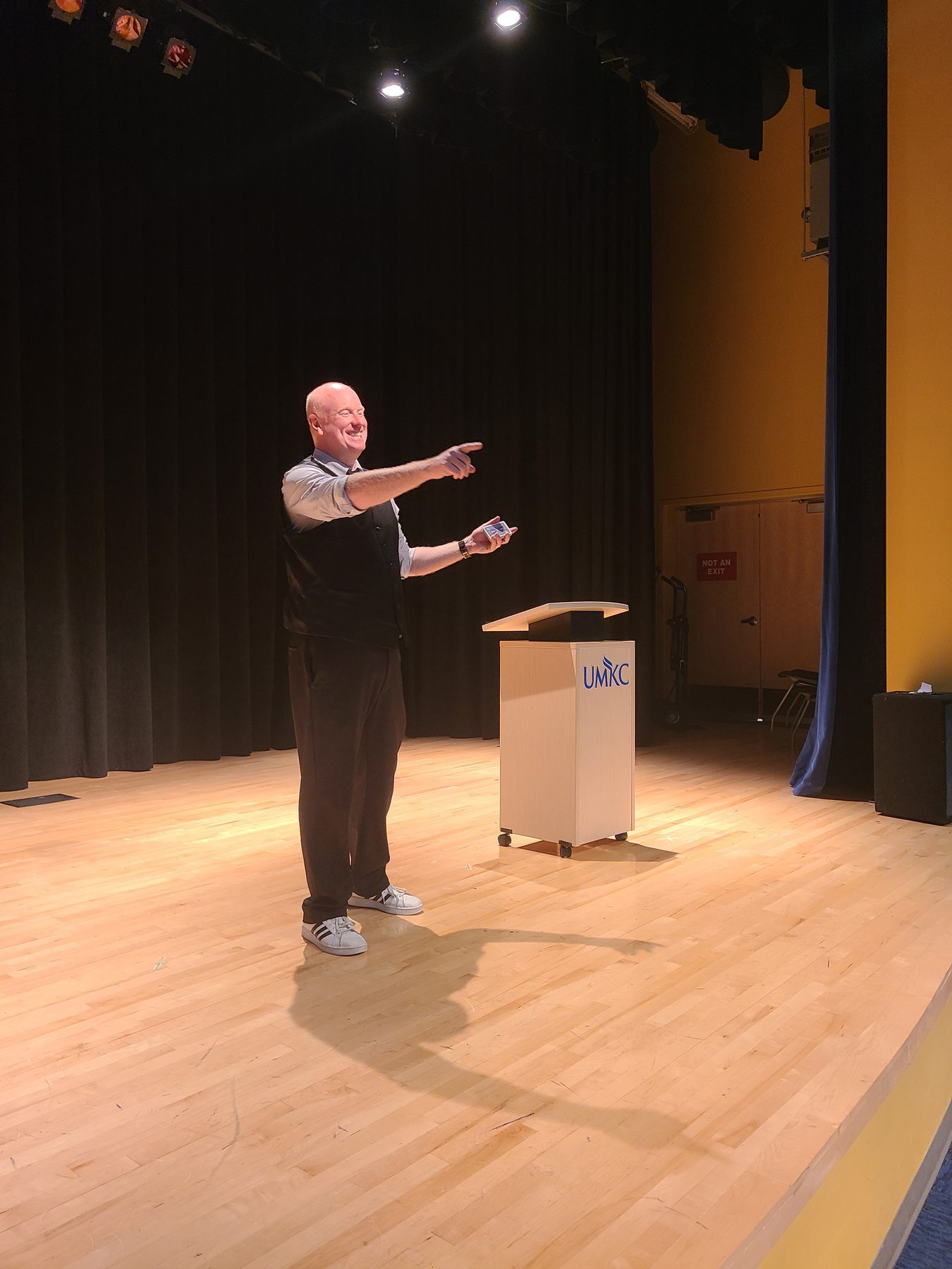 On stage at UMKC, the moment a signed card turns up where nobody put it.