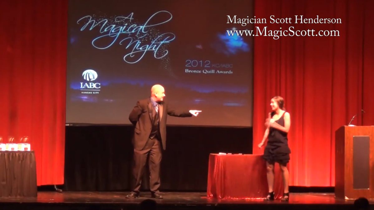 Scott Henderson performing a corporate magic show at the Uptown Theater in Kansas City