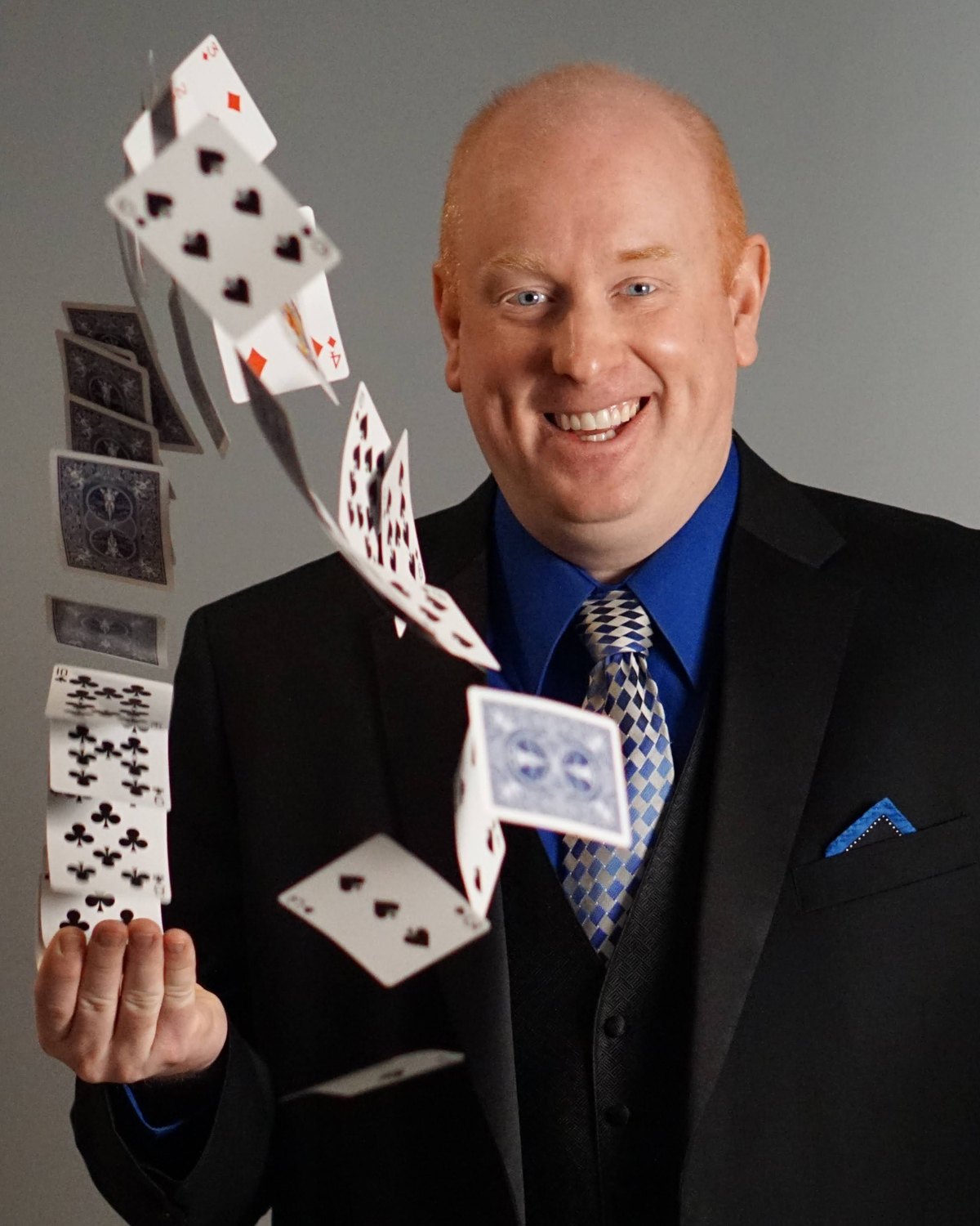 Scott Henderson, Kansas City magician, with cards cascading from his hand
