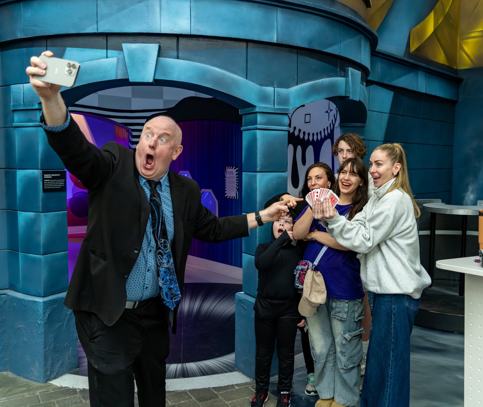Scott Henderson taking a selfie with a laughing audience after a magic show at Science City, Union Station